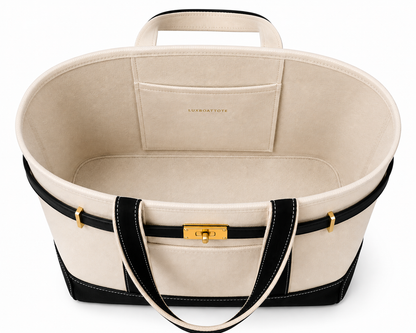 An oval-shaped cream canvas organizer tote bag with black trim, double top handles, and a gold-tone front clasp, shown from a top-down view on a white background.